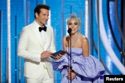 FILE - Presenters Bradley Cooper and Lady Gaga take the stage at the 76th Golden Globe Awards in Beverly Hills, California, Jan. 6, 2019.