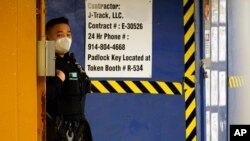 An Asian American New York City Police officer patrols a train station in Flushing, NY, as Police have stepped up patrols across the city in the wake of vicious attack on a 65 year-old Asian American woman in Times Square.