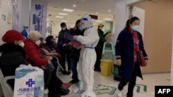 FILE - COVID-19 patients are seen at the Second Affiliated Hospital of Chongqing Medical University in China's southwestern city of Chongqing on Dec. 23, 2022.