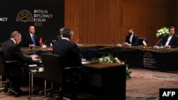 Turkish Foreign Minister Mevlut Cavusoglu (C), Russian Foreign Minister Sergei Lavrov (L) and Ukraine's Foreign Minister Dmytro Kuleba (R) attending Russia-Turkey-Ukraine tripartite Foreign Ministers meeting in Antalya, March 10, 2022. (Turkish Foreign Ministry Press Office/AFP) 