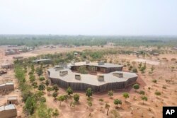 This image released by the Pritzker Prize shows the Lycée Schorge in Burkina Faso. The Pritzker Architecture Prize has been awarded to its designer, Berlin-based architect Diébédo Francis Kéré. (Francis Kéré via AP)