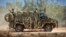На фото: Бронетранспортер Bushmaster австралійської армії під час навчань 7 липня 2021 року в Таунсвіллі, Австралія