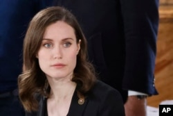FILE: Finland's Prime Minister Sanna Marin attends an EU summit at the Palace of Versailles, near Paris, March 10, 2022