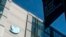 FILE - A Twitter logo hangs outside the company's San Francisco offices on Nov. 1, 2022. 
