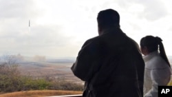 This photo provided Nov. 19, 2022, by the North Korean government shows North Korean leader Kim Jong Un and his daughter at Pyongyang International Airport in Pyongyang, North Korea, Nov. 18, 2022.