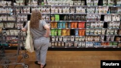 A person shops in a supermarket in Manhattan, New York City, as inflation affected consumer prices, June 10, 2022. 