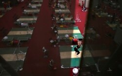 In this July 20, 2021, file photo, an athlete trains at the weightlifting training hall at the 2020 Summer Olympics, Tuesday, July 20, 2021, in Tokyo. (AP Photo/Petr David Josek, File)