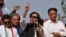 Pakistan’s former Prime Minister Imran Khan, center, speaks during a rally in Islamabad, May 26, 2022. 