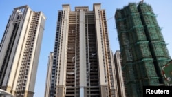 FILE - In China, many homebuyers have stopped paying their mortgage.
