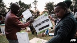 Presiding officers check electoral material at the tallying center in Kilgoris, Kenya, Aug. 8, 2022.