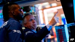 FILE - Traders work on the New York Stock Exchange floor, Sept. 13, 2022. (AP Photo/Julia Nikhinson)
