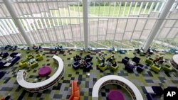 Students work in the Rain Garden Reading Lounge inside the Hunt Library at North Carolina State University in Raleigh, N.C., May 3, 2016.