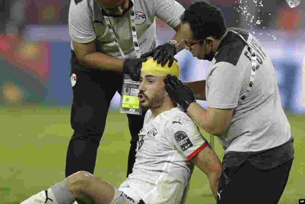 Egypt's Mahmoud Hamdy El-Wensh has his head bandaged during the game against Cameroon, Feb. 3, 2022.