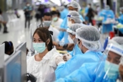 A person receives China's Sinovac coronavirus disease (COVID-19) vaccine at the Central Vaccination Center, inside the Bang Sue Grand Station, in Bangkok, Thailand, May 24, 2021. REUTERS