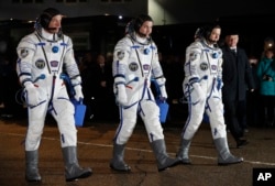 From left: NASA astronaut Jeff Williams, Russian cosmonauts Alexei Ovchinin, and Oleg Skripochka of Roscosmos, members of the main crew of the expedition to the International Space Station (ISS), March 19, 2016.