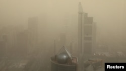 FILE - A general view shows the skyline of Beijing, China, shrouded in smog, March 15, 2021. (REUTERS/Tingshu Wang)