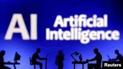 FILE - Figurines with computers and smartphones are seen in front of the words "Artificial Intelligence AI" in this illustration taken, February 19, 2024. (REUTERS/Dado Ruvic/Illustration/File Photo)