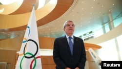 FILE - Thomas Bach, President of the International Olympic Committee (IOC), speaks in Lausanne, Switzerland, March 25, 2020.