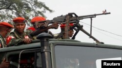 Military police officers ride on a truck as they patrol the streets of Kinshasa, Democratic Republic of Congo, June 29, 2017. 
