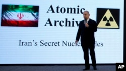 A Palestinian girl cries as she is comforted by her uncle after Israeli forces demolished her family's house near Hebron in the West Bank.