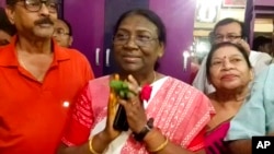 India's governing Bharatiya Janata Party's presidential candidate Draupadi Murmu, greets well-wishers who called on her at Raigangpur in Odisha, India, June 22, 2022. 