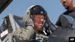 Air Force Secretary Frank Kendall in the cockpit of an X-62A VISTA at Edwards Air Force Base, Calif., on May 2, 2024. The AI-controlled plane flew Kendall in maneuvers that put 5Gs of pressure on his body at speeds exceeding 550 miles an hour. (AP Photo/Damian Dovarganes)