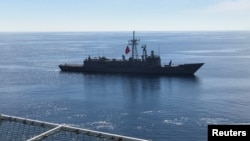 FILE - Turkish Navy frigate Gaziantep escorts drilling vessel Fatih off the Mediterranean resort city of Antalya, Turkey, Oct. 30, 2018.