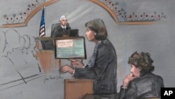 In this courtroom sketch, defense attorney Judy Clarke is depicted addressing the jury as defendant Dzhokhar Tsarnaev, right, sits during closing arguments in Tsarnaev's federal death penalty trial, April 6, 2015, in Boston. 