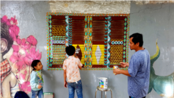 Srey Bandaul seen here with a group of artists and professionals from Phare Ponleu Selpak during a trip. (Courtesy of Phare Ponleu Selapak)