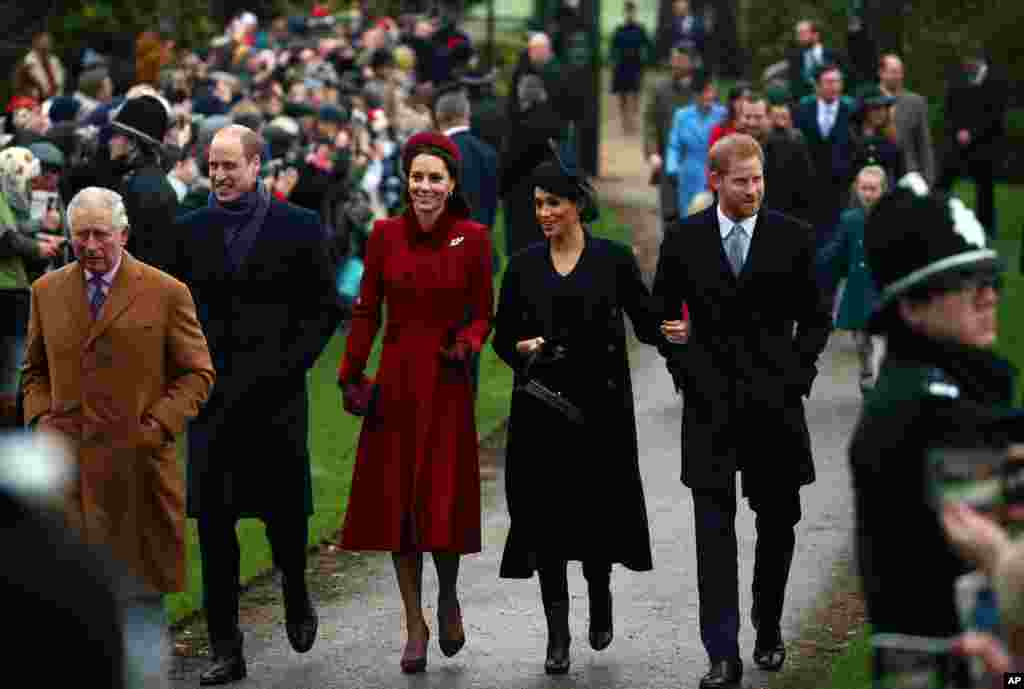 Britain's Prince Charles, Prince William, Duke of Cambridge and Catherine Duchess of Cambridge along with Prince Harry, Duke of Sussex and Meghan, Duchess of Sussex arrive at St. Mary Magdalene's church for the Royal Family's Christmas Day service on the on the Sandringham estate in eastern England, Dec. 25, 2018