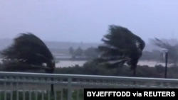 Trees blow in strong winds as Hurricane Isaias hits the Bahamas on July 31, 2020 in this still image taken from social media video, filmed from the Grand Isle Resort and Spa at Emerald Bay, Great Exuma.