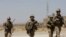 FILE - U.S. troops patrol at an Afghan National Army (ANA) Base in Logar province, Afghanistan, Aug. 7, 2018. 