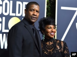 Denzel Washington, left, and Pauletta Washington arrive at the 75th annual Golden Globe Awards at the Beverly Hilton Hotel on Sunday, Jan. 7, 2018, in Beverly Hills, Calif.