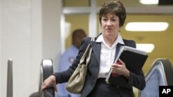 Senator Susan Collins of Maine, ranking Republican on the Senate Homeland Security and Governmental Affairs Committee, walks to a meeting with UN Ambassador Susan Rice, on Capitol Hill in Washington, November 28, 2012.