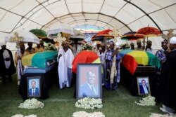 The coffins of Amhara Regional President Ambachew Mekonnen and two other officials who were killed in an attack are seen during a funeral ceremony in the town of Bahir Dar, Amhara region, Ethiopia, June 26, 2019.