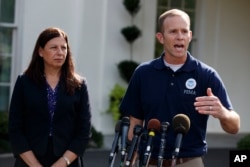 FEMA Administrator Brock Long, accompanied by acting Secretary of Homeland Security Elaine Duke, speaks to reporters about hurricane recovery efforts in Puerto Rico, outside the White House, Sept. 26, 2017, in Washington.