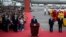 China's President Xi Jinping speaks upon his arrival at Macau's international airport in Macau on Dec. 18, 2024, ahead of celebrations for the 25th anniversary of Macau's handover from Portugal to China.