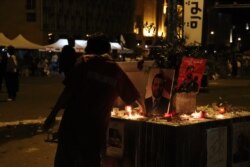 Memorials mark the death of a demonstrator who was taking part in a road block, pictured on Nov. 16, 2019 in Beirut, Lebanon. (H. Murdock/VOA)
