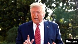 U.S. President Donald Trump responds to reporter's questions as he departs to Texas from the White House, Washington, DC, U.S., September 22, 2019. REUTERS/Mike Theiler