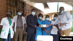 Members of the COVID Response Private Citizens Initiative donate medical equipment at a public hospital in Malawi. (COVID Response Private Citizens Initiative)
