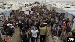 Syrian refugees take part in a demonstration at the Zaatari refugee camp, near the border with Syria. (File photo).