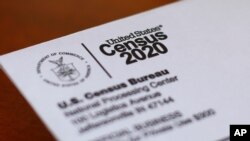 FILE - An envelope contains a 2020 census letter mailed to a U.S. resident in Detroit, Michigan, April 5, 2020.