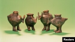 Late Bronze Age feeding vessels from Vosendorf, Austria, are seen in this image released on September 25, 2019. A study in the journal Nature found that similar vessels were used to feed milk to babies. (Enver-Hirsch/Wien Museum/Handout via REUTERS)