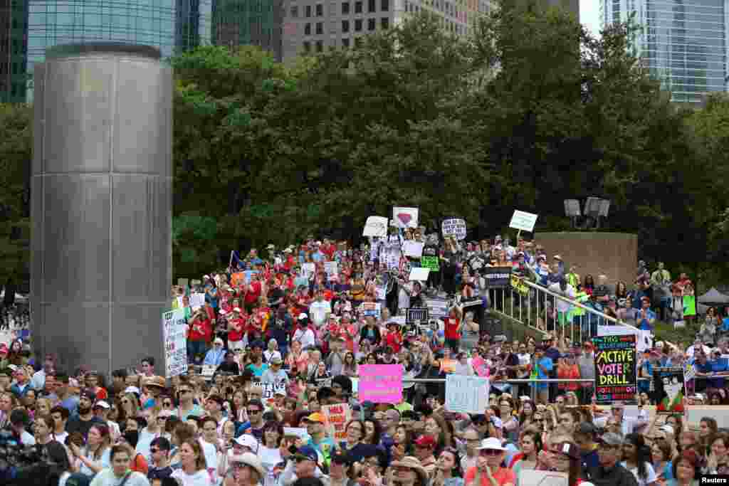 People gather to walk with the "March for Our Lives" demonstration in Houston.
