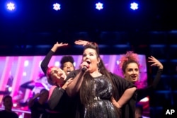 Israeli singer Netta Barzilai, center, who won the 2018 Eurovision song contest, performs at Rabin Square in Tel Aviv, Israel, May 14, 2018.