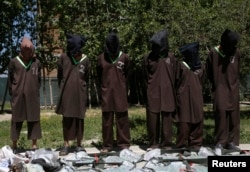 FILE - Insurgents suspected of being from the Haqqani network are presented to the media at the National Directorate of Security (NDS) headquarters in Kabul, May 30, 2013.