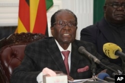 FILE - Then-President Robert Mugabe delivers a speech in Harare, Zimbabwe, Nov, 19, 2017.