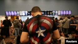 Fans of the Avengers series wait for an early premiere of "The Avengers: Endgame" movie in La Paz, Bolivia, April 24, 2019. 