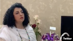 FILE - In this screen grab from a Twitter video posted by her husband, Taghi Rahmani, Iranian human rights activist Narges Mohammadi is seen at her parents' home in Iran, Oct. 8, 2020.