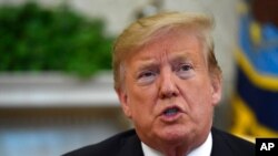 Le président Donald Trump dans le bureau ovale de la Maison Blanche à Washington, le 27 mars 2019.